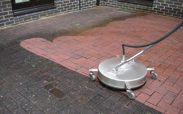 Patio Cleaning or driveway cleaning on dirty sandstone